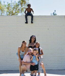 A group of people standing on top of a wall.