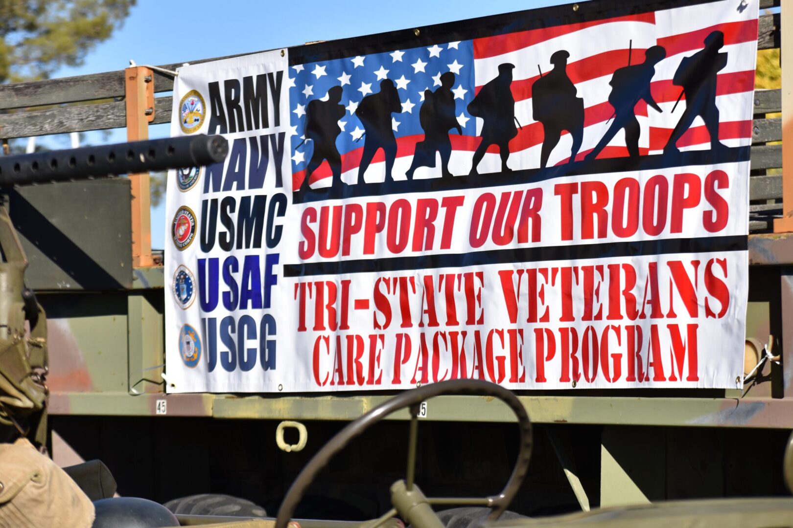 A sign with military themed images on it.