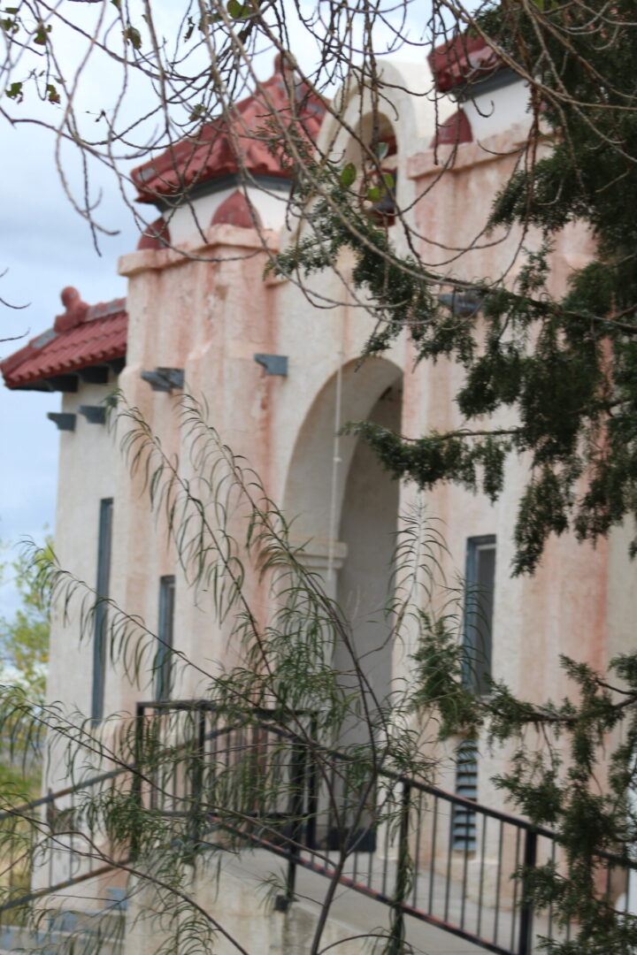 A building with red roof and white walls