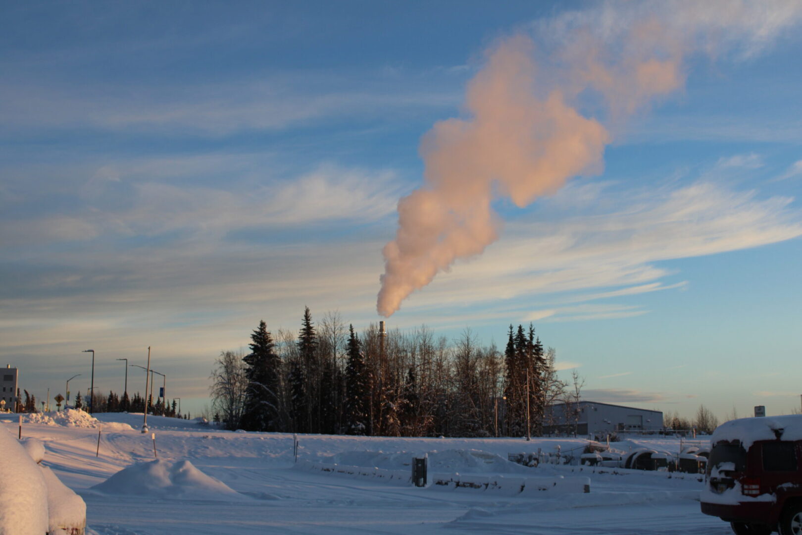 A large cloud of smoke is coming out from the top.