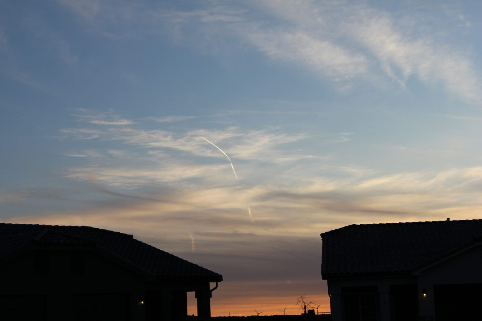 A sky filled with lots of clouds at sunset.