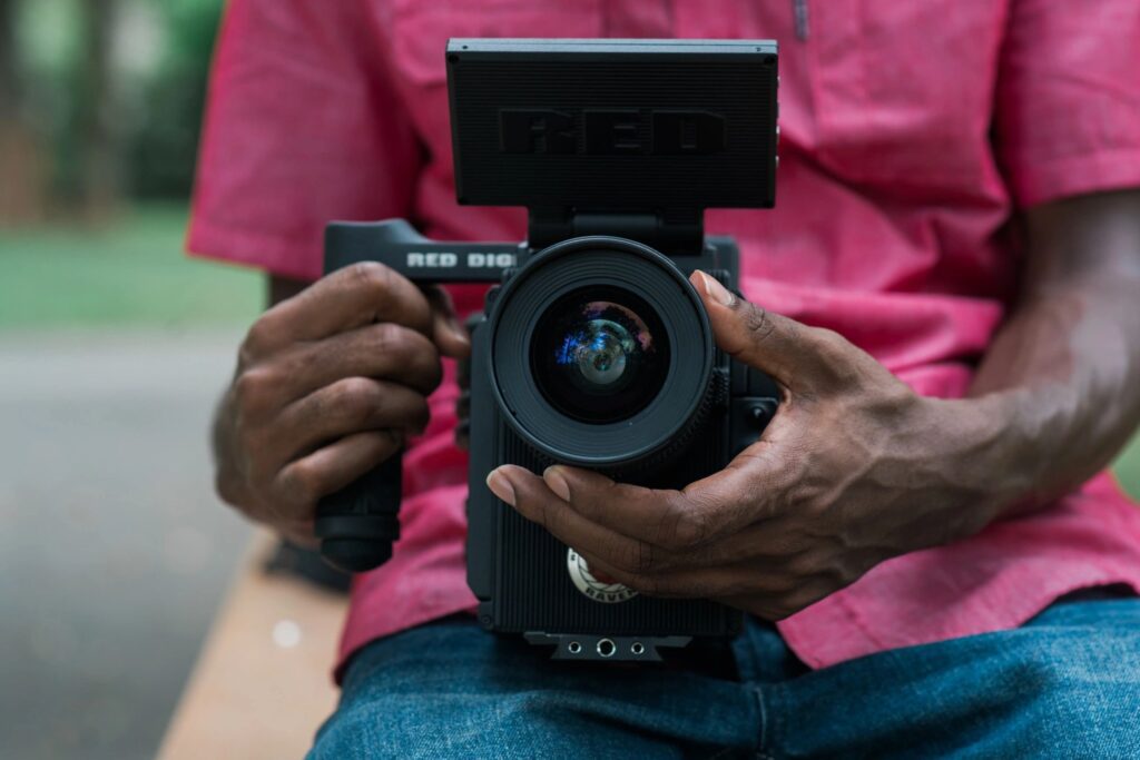 A man holding a camera in his hand.