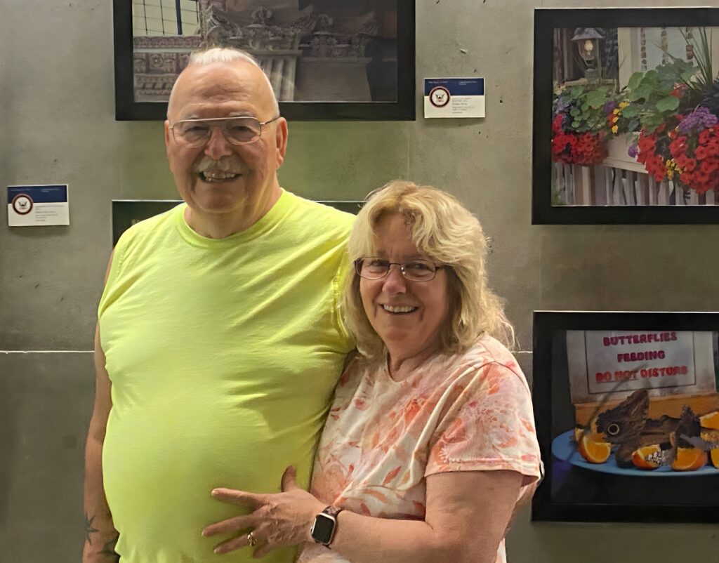 A man and woman standing next to each other.