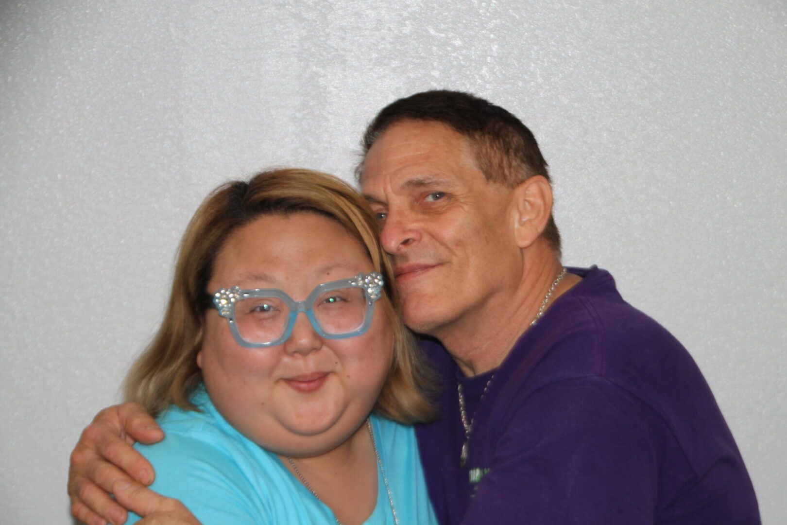 A man and woman posing for the camera.